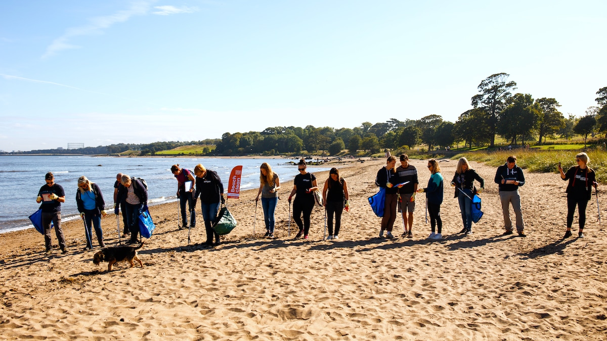 Marine Conservation Society volunteers work together on a beach cleanup