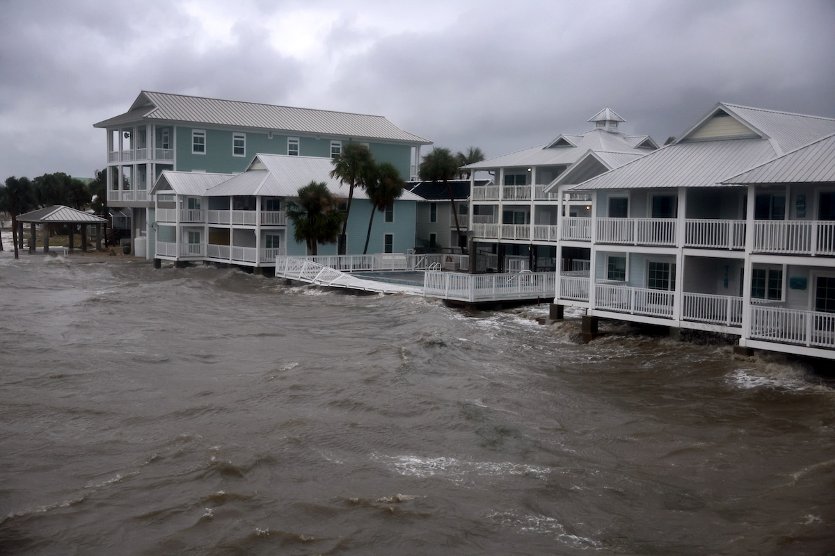 Buildings on the coast face flooding from the rain and storm surge from Hurricane Debby in Cedar Key, Florida